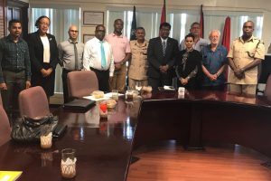 Public Security Minister Khemraj Ramjattan (fifth from right), acting Police Commissioner David Ramnarine (sixth from right) and acting Prisons Director Gladwin Samuels (at extreme right) with members of the Private Sector Commission (Private Sector Commission photo)