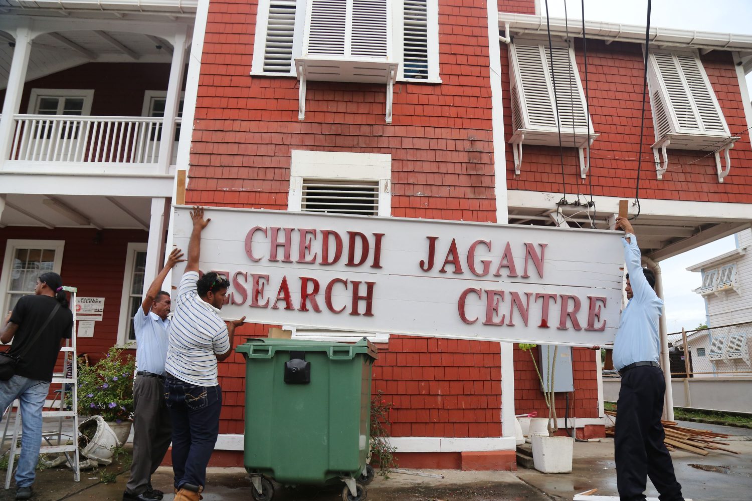The sign for the CJRCI being restored at Red House after it was torn down. (December 2016 / Keno George/Stabroek News file photo)