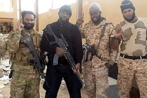 FLASHBACK: fighting for isis: Trinidadian fighters Shane Crawford, from left, Arshad Mohammed and three other unidentified Trinidadians pose for a photo, wearing military gear and holding assault weapons, in Syria in 2015.
