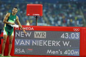 Gold medalist Wayde van Niekerk (RSA) of South Africa points to the board showing his new world new record following the men’s 400m final at the Rio Olympic games in Brazil. (Reuters)
