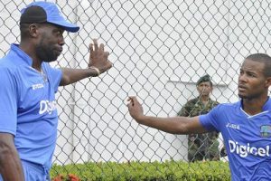 Sir Curtly Ambrose (left) chats with Shai Hope during a previous West Indies tour. 