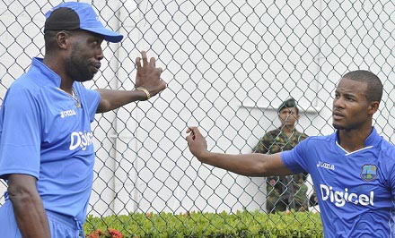 Sir Curtly Ambrose (left) chats with Shai Hope during a previous West Indies tour. 