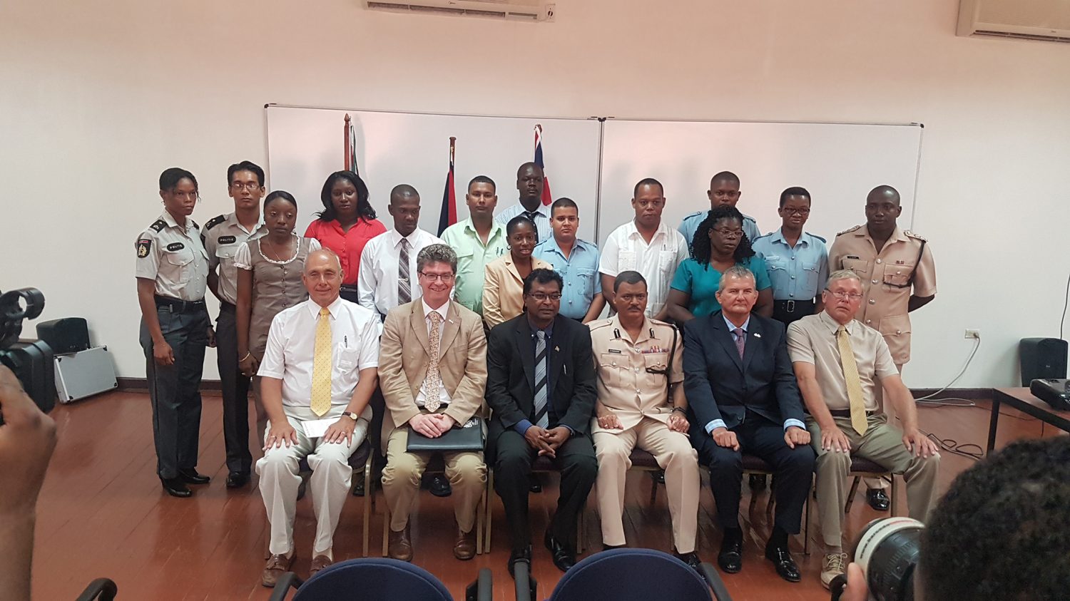 Seated, from second, at left, are British High Commissioner to Guyana Greg Quinn, Public Security Minister Khemraj Ramjattan, acting Police Commissioner David Ramnarine and UK security expert Lt Col (rtd) Russell Combe, with the two trainers and participants of the training course. Standing to the left are the two Suriname Police Force participants. (Photo courtesy of the British High Commission)