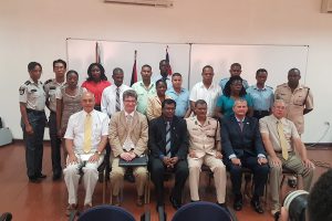 Seated, from second, at left, are British High Commissioner to Guyana Greg Quinn, Public Security Minister Khemraj Ramjattan, acting Police Commissioner David Ramnarine and UK security expert Lt Col (rtd) Russell Combe, with the two trainers and participants of the training course. Standing to the left are the two Suriname Police Force participants. (Photo courtesy of the British High Commission)
