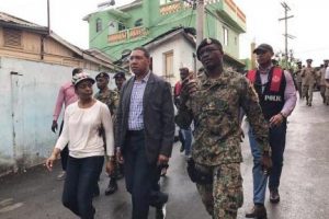 Prime Minister Andrew Holness (second from left) is flanked by Attorney General Marlene Malahoo Forte, member of parliament for St James West Central, and Major Godphey Sterling, who is leading the Jamaica Defence Force’s efforts in Mount Salem, St James. Holness was touring the community, which was last week named the first zone of special operations. 