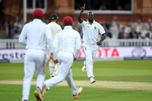 Seamer Kemar Roach (right) celebrates another wicket on the opening day at Lord’s on Thursday. (Photo courtesy CWI Media) 