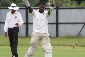 Ricardo Adams raises his bat to his teammates after registering his second century of the league which guided Essequibo over the line (Royston Alkins Photo)