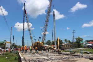 Bagotville Bridge works: Works underway to reconstruct the Bagotville Bridge, which had to be closed two months ago after a section started to sink. Pile driving was underway yesterday. According to on-site engineers, the new bridge should be completed within two months’ time. (Keno George photo)
