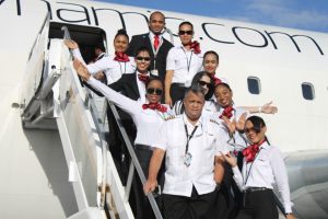 Local representative of Dynamic Airways Captain Gerry Gouveia (left at front) with some of the airline’s flight
attendants in more prosperous times for the entity. (Stabroek News file photo)