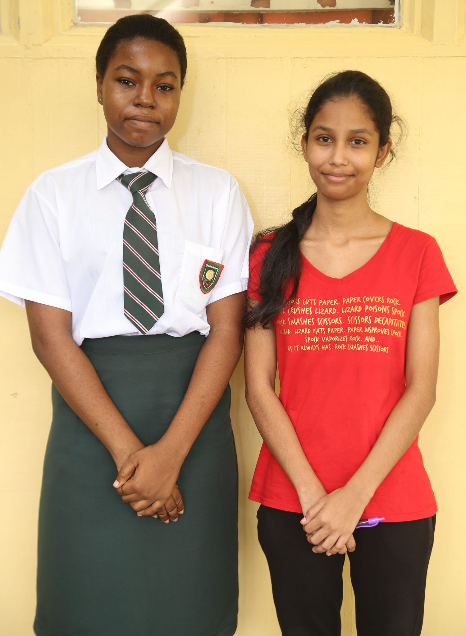 The Bishops’ High School’s top CSEC and top CAPE performers, Sarah Grannum (left) and Carissa Kissoon. (Keno George photo)