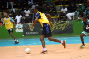 Flashback- Gerald Gritten of North Ruimveldt (center) on the attack against Future Stars in their quarterfinal clash in the Guinness ‘Cage’ Football Championship at the National Gymnasium, Mandela Avenue. 