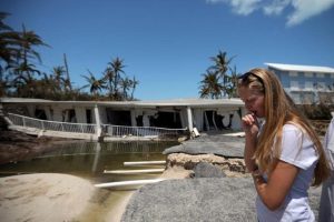 A local resident reacts as she sees the damage on her home after Hurricane Irma struck Florida, in Islamorada Key, U.S., September 12, 2017. REUTERS photo