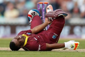 Evin Lewis was left writhing in pain by the incident (Reuters photo)