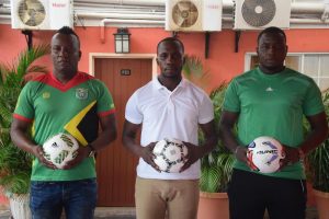 Tournament Coordinator Linden Gill (centre) posing alongside Referees Coordinator Wayne Griffith (left) and Captain of the African Team David Chimda at the launch of the inaugural Street Vibes Entertainment coordinated, ‘National Futsal Cup’ at the Windjammer Hotel, Kitty
