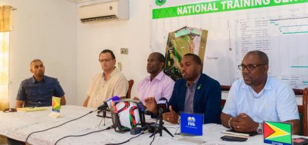 Wayne Forde (second from right), President of the GFF making a point to the media gathering at the formal launch of the FIFA Forward Project Phase One step. Also at the table are Raphael Nabi (left) of Nabi and Sons Construction, Greenfields representative Johannes Van Krimpen (second left), GFF second  Vice-President Bruce Lovell (third from left) and GFF third Vice-President Rawlston Adams (right).
