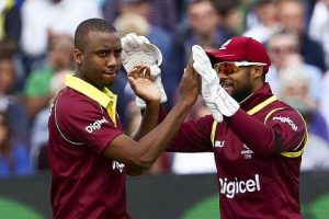  Fast bowler Miguel Cummins (left) celebrates one of his three wickets with wicketkeeper Shai Hope during Sunday’s ODI. (Photo courtesy CWI Media)