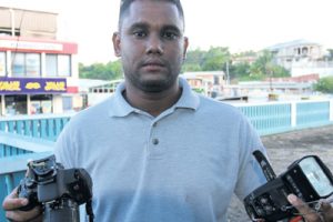 Guardian Media photographer Kristian De Silva displays his damaged equipment after he was attacked while photographing A&V Oil and Gas in Penal, the company named in a Petrotrin internal audit.
