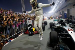 Lewis Hamilton celebrates winning yesterday’s Formula One race in Singapore. (Reuters photo)