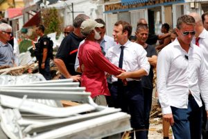 France’s President Emmanuel Macron  (centre) talks with a resident during his visit to St Martin yesterday. Reuters/Christophe Ena/Pool