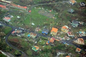 Damaged homes from Hurricane Maria are shown in this aerial photo over the island of Dominica Tuesday. | COURTESY NIGEL R. BROWNE / CARIBBEAN DISASTER EMERGENCY MANAGEMENT AGENCY / REGIONAL SECURITY SYSTEM / HANDOUT / VIA REUTERS