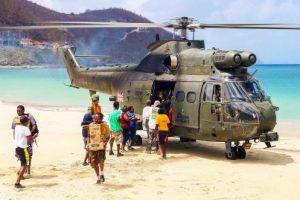 An RAF Puma helicopter of 33 Squadron on the beach of Cane Garden Bay to deliver aid to residents in Tortola, the largest of the British Virgin Islands Photo Joel Rouse/PA Wire