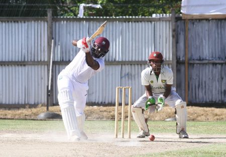 Raymon Reifer goes through the off - side during his century for West Demerara (Orlando Charles Photo) 