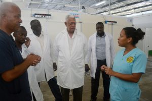 Minister of Agriculture Noel Holder (third from right) during a tour of the hatchery. (Ministry of Agriculture photo) 