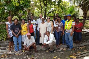 Managing Director of GWI, Dr Richard Van West-Charles; Chairperson of GWI’s Board of Directors, Patricia Chase-Green; other GWI officials and some of the residents of Tucville Terrace who now have access to running water. (GWI photo)
