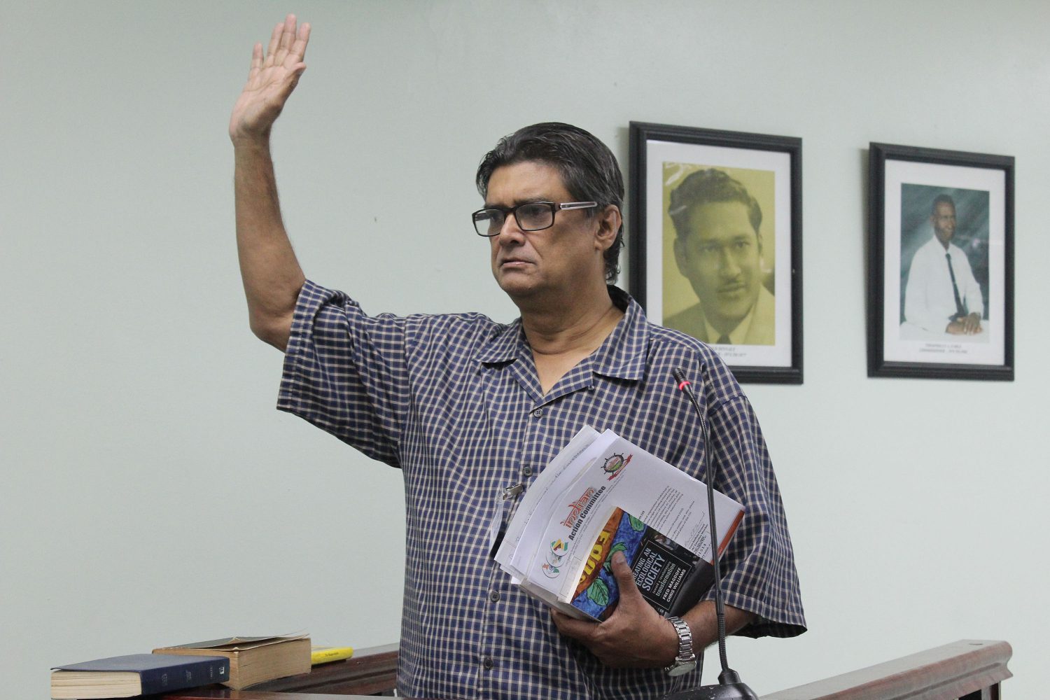 Evan Persaud being sworn in before the Commission of Inquiry established to investigate ancestral land matters. (Commission of Inquiry photo) 