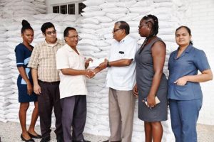 GAWU General Secretary,  Seepaul Narine (third from left) presenting the donation to CDC Director, Colonel (Ret’d) Chabilall Ramsarup in the presence of officials from the Union and the CDC