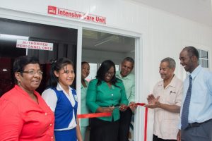 Minister in the Ministry of Public Health, Dr Karen Cummings cuts the ribbon to commission the ICU at the Bartica Regional Hospital. Regional Health Officer, Dr Edward Sagala is second from right. Regional Chairman, Gordon Bradford is third from right. (Department of Public Information photo)