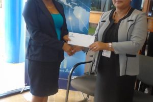 GBTI’s Lethem Branch Manager, Sharon King presenting the cheque to Miriam Saba of the Lethem Town Council
