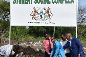 UG Vice-Chancellor Ivelaw Griffith (second, from left), turns the sod for the Student Society building with the current and past student presidents on Thursday. (Department of Public Information photo)