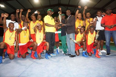 The victorious GDF outfit along with Coach, Terrence Poole pictured with the best gym award, pose for a photo opportunity. 