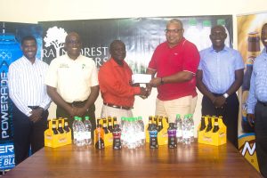 GHB Vice President, Allan Newark (third from right), receiving the sponsorship cheque from Troy Peters, Banks DIH Communications Manager. Looking on (from left to right) are Banks DIH managers, Errol Nelson, Clive Pellew, Clayton McKenzie and Mortimer Stewart
