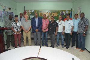 Minister of State Joseph Harmon (third, from left in front row) with some of the donors yesterday