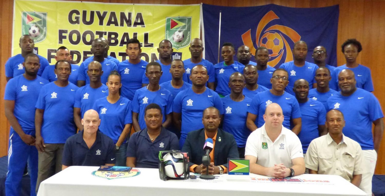 Participants for the CONCACAF D License course posing with CONACACF Instructors Vincent Ganzberg (sitting first left) and Antony Corneal (sitting second left) as well as GFF President Wayne Forde (sitting centre), GFF Technical Director Ian Greenwood (sitting second right) and GFF Executive Committee Member Keith O’Jeer following the launch of the CONCACAF D License programme.