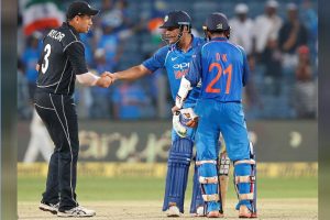 India’s Mahendra Singh Dhoni (C) shakes hands with New Zealand’s Ross Taylor as Dinesh Karthik looks on after India won the match. REUTERS/Amit Dave.