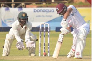 Shai Hope drives during his unbeaten 90 on the opening day of the first Test against Zimbabwe yesterday. (Photo courtesy CWI Media)