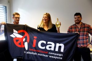 Beatrice Fihn, Executive Director of the International Campaign to Abolish Nuclear Weapons (ICAN) receives a bottle of champagne from her husband Will Fihm Ramsay (R) next to Daniel Hogsta, coordinator, while they celebrate after ICAN won the Nobel Peace Prize 2017, in Geneva, Switzerland October 6, 2017. REUTERS/Denis Balibouse