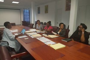 Senior technical officer within the Ministry of Education,  Bridget Hinds (left) engaging executive members of IPoG. (Ministry of Education photo)
