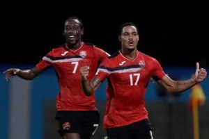 Alvin Jones (right) celebrates with Nathan Lewis following his wonder strike for Trinidad and Tobago in the World Cup qualifier against United States on Tuesday night.
