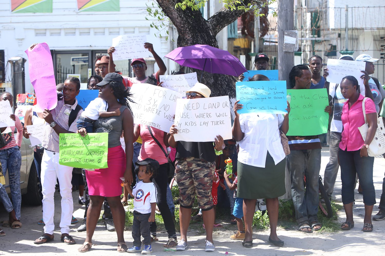 The group of residents and their children protesting in front of the CH&PA Headquarters yesterday (Keno George photo) 