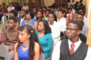 Graduates of the Youth Leadership Training Programme listening intently. (Ministry of the Presidency photo)