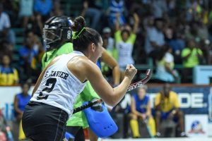 Joy-Gabriella Xavier of Guyana celebrates after opening the scoring against Barbados at the Cliff Anderson Sports Hall in the Pan American Indoor Hockey Championship.