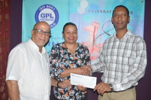(From right) GPL’s Divisional Director- Projects  Ryan Ross hands over the cheque to Fiona Legall, General Manager and Dr. Syed Ghazi, Director of Medical Outreach & resident Doctor of the Cancer Institute of Guyana (GPL photo)  