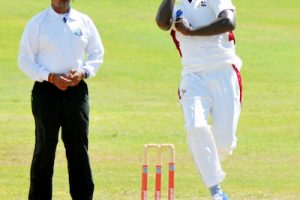 Umpire Danesh Ramdhanie watches Leeward Islands Hurricanes fast-medium bowler Gavin Tonge bowl during the Barbados Pride second innings (CWI Media photo/ Kerrie Eversley) 