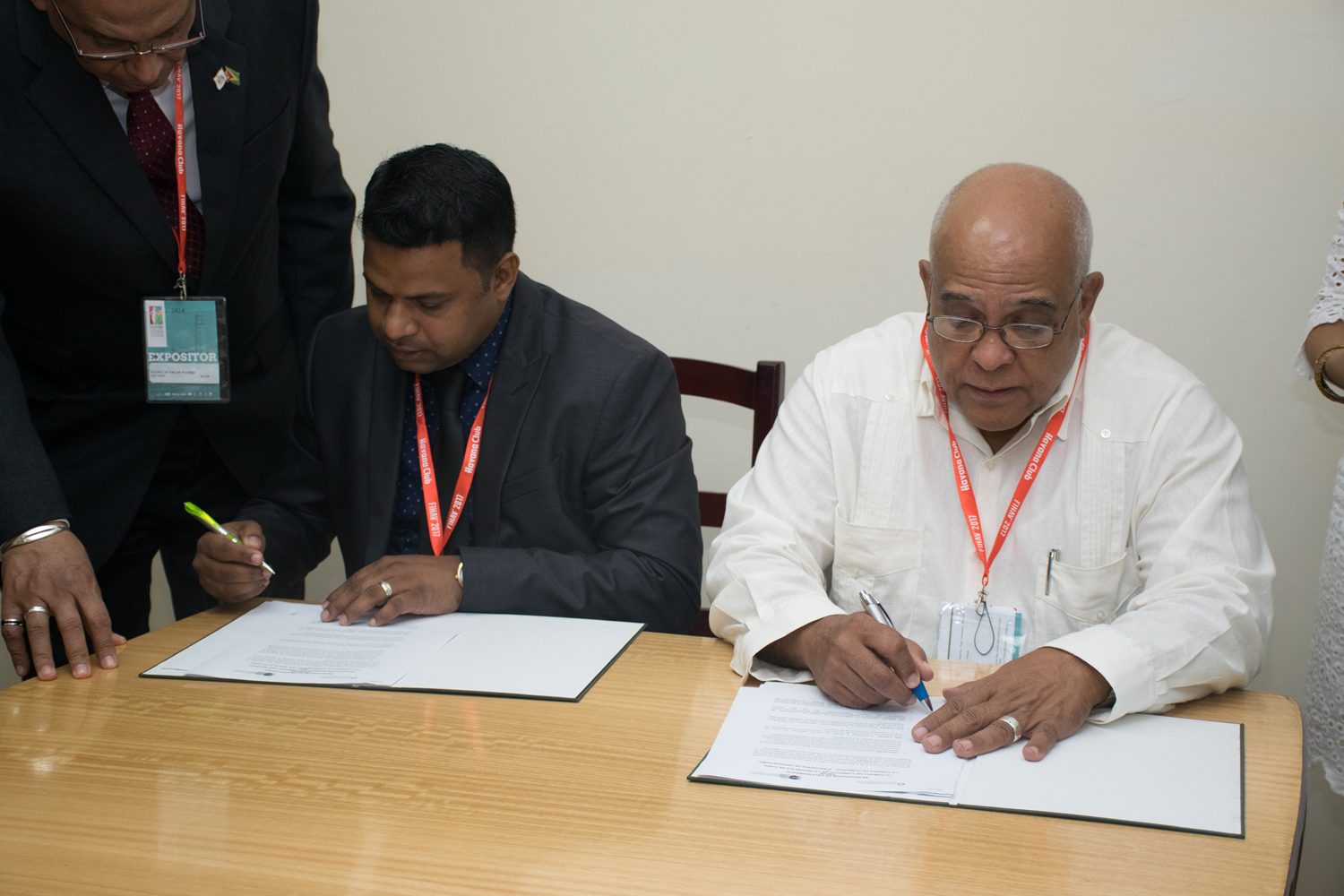President of the Georgetown Chamber of Commerce and Industry, Deodat Indar (left) and President of the Chamber of Commerce of the Republic of Cuba, Orlando Hernández Guillén signing the MOU (DPI photo).