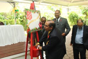 Acting President Moses Nagamootoo making the first donation to the Salvation Army’s symbolic Christmas kettle yesterday at the launch of the organisation’s annual Christmas Appeal at the Georgetown Club at the Georgetown Club. (Keno George photo)