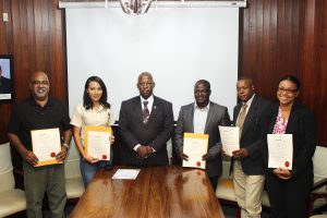 The Guyana National Broadcasting Authority (GNBA) yesterday handed out licences to five radio broadcasters. From left are Neaz Subhan, of Radio Guyana Inc 89.5FM, Meleisa De Freitas, of National Television Network Radio Inc., GNBA Chairman Leslie Sobers, Maxwell Thom, of Wireless Connections, National Communications Network (NCN) Chief Executive Officer  Lennox Cornette and Renatha Exeter, of iRadio Inc.